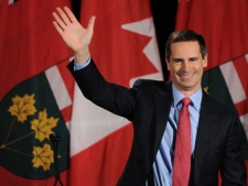 Liberal leader Dalton McGuinty takes to the stage at his campaign headquarters in Ottawa, Thursday October 6, 2011 after his party fell one seat short of a majority government. (THE CANADIAN PRESS/Sean Kilpatrick)