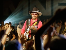 Hank Williams Jr. performs during the recording of a promo for NFL Monday Night Football in Winter Park, Fla., Thursday, July 14, 2011. Williams recorded the promo even though the upcoming season still remains in limbo. (AP Photo/John Raoux)