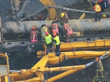 EMS crews attempt to rescue trapped workers after a crane collapse near York University on Tuesday, Oct. 11, 2011.