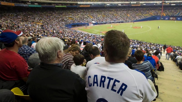 A fan wears a Gary Carter Montreal Expos uniform a