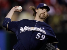 Milwaukee Brewers relief pitcher John Axford throws during the ninth inning of Game 4 of baseball's National League championship series against the St. Louis Cardinals Thursday, Oct. 13, 2011, in St. Louis. (AP Photo/Matt Slocum)