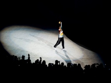 A former Olympian runs in the torch in the Omnilife stadium during the opening ceremonies of the 2011 Pan American Games in Guadalajara, Mexico on Friday, Oct. 14, 2011. THE CANADIAN PRESS/Nathan Denette