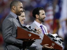 Jose Bautista of the Toronto Blue Jays, right, and Matt Kemp of the Los Angeles Dodgers hold their Hank Aaron Awards in a ceremony before Game 5 of the World Series, Monday, Oct. 24, 2011, in Arlington, Texas. (AP Photo/Matt Slocum)