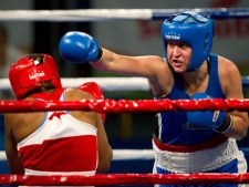 Canada's Mary Spencer, right, takes on Yenebier Gillen, left, of the Dominican Republic, in the 75kg gold medal bout during the 2011 Pan American Games in Guadalajara, Mexico on Friday, Oct. 28, 2011. Spencer won the gold medal. THE CANADIAN PRESS/Nathan Denette