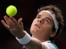 Milos Raonic of Canada serves the ball to Julien Benneteau of France during their match in the Paris Tennis Masters tournament, in Paris, Monday, Nov. 7, 2011. (AP Photo/Lionel Cironneau)