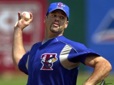 Toronto Blue Jays starting pitcher Pete Walker delivers a throw against the Boston Red Sox during the first inning in Fort Myers, Fl, Sunday March 9, 2003. (AP Photo/Charles Krupa)