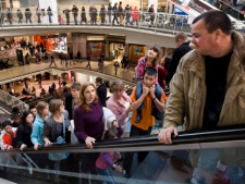 Thousands of people line all levels of the Eaton Centre while doing some last-minute Christmas shopping in Toronto, Dec. 23, 2009. (THE CANADIAN PRESS/Darren Calabrese)