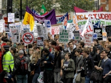 Students and campaigners march through the streets of London to protest against higher tuition fees and government cuts, Wednesday, Nov. 9, 2011. Some 4,000 police officers were deployed along the route, which wound from the University of London to the city's financial district. (AP Photo/Sang Tan)