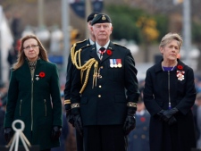 Governor General David Johnston (centre), his wife Sharon (right) and 2011 Silver Cross Mother Patty Braun, a Saskatchewan widow whose son was killed in Afghanistan in 2006, participate in Remembrance Day ceremonies Friday, Nov. 11, 2011 on Parliament Hill in Ottawa. (THE CANADIAN PRESS/Adrian Wyld)