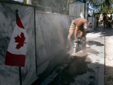 Canadian Forces engineers dismantle the Canadian War Memorial at Kandahar Air Field Saturday, November 12, 2011 in Kandahar, Afghanistan. The entire monument will be shipped to Canada and reassembled in the Ottawa area after the final Remembrance Day ceremony was held here yesterday.THE CANADIAN PRESS/Ryan Remiorz