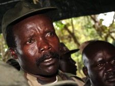 In this Nov. 12, 2006 file pool photo, the leader of the Lord's Resistance Army, Joseph Kony answers journalists' questions following a meeting with UN humanitarian chief Jan Egeland at Ri-Kwamba in southern Sudan. (AP Photo/Stuart Price)