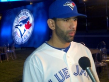 Toronto Blue Jays slugger Jose Bautista shows off one of the new uniforms on the field at Rogers Centre Friday. (George Lagogianes/CP24)