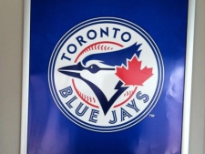 The Toronto Blue Jays' new logo is pictured on a poster at Rogers Centre on Friday, Nov. 18, 2011. (TSN/Gareth Wheeler)f