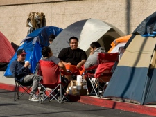 Jesus Gaspar, Ryan Leuta, Gilbert Mendoza and Ruben Mendoza, all students at Goldenwest College, camp out in front of Best Buy, Tuesday, Nov. 22, 2011, in Westminster, Calif. The students have camped out since Sunday awaiting Black Friday sales. (AP Photo/The Orange County Register, Joshua Sudock)