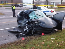 A man in his 20s died when a car and dump truck collided on Wolfedale Road in Mississauga on Thursday, Nov. 24, 2011. (CTV/Andrew Collins)