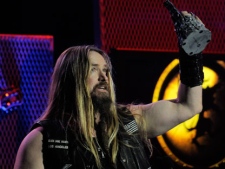 Zakk Wylde celebrates after receiving the Epiphone Best Guitarist award at the second annual Revolver Golden Gods Awards in Los Angeles, Thursday, April 8, 2010. (AP Photo/Chris Pizzello)