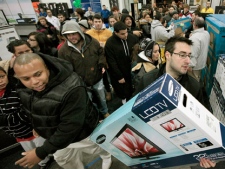 Black�Friday shoppers rush into Best Buy in North Dartmouth, Mass., early Friday, Nov. 25, 2011. Thousands of shoppers lined up at Macy's, Best Buy and other stores nationwide to buy everything from toys to tablets on Black Friday despite the economic downturn and some planned protests of the shopping holiday. (AP Photo/The Standard-Times, Peter Pereira)