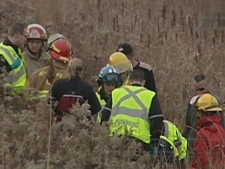 Emergency crews at the scene of a helicopter crash near Waterloo, Ont., Monday, Nov. 28, 2011.