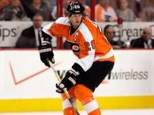 Philadelphia Flyers Chris Pronger looks fore an open man to pass to in the first period of an NHL hockey game with the Vancouver Canucks, Wednesday, Oct. 12, 2011, in Philadelphia. (AP Photo/Tom Mihalek)