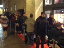 People wait in line outside the Loblaws at Maple Leaf Gardens before its official grand opening Wednesday, Nov. 30, 2011. (CP24/Katie Simpson)