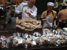 A worker chips away at a mound of chocolate at the new Loblaws at Maple Leaf Gardens on its opening day Wednesday, Nov. 30, 2011. (CP24/Katie Simpson)