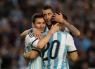 Argentina's Lionel Messi, left, celebrates with Argentina's Angel Di Maria, center, and Argentina's Sergio Aguero after scoring against Slovenia during their international friendly soccer match in La Plata, Argentina, Saturday, June 7, 2014. Argentina's team is leaving June 9 for Brazil to compete in the World Cup. (AP Photo/Eduardo Di Baia)