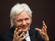 WikiLeaks founder Julian Assange gestures as he talks during a news conference in central London, Thursday, Dec. 1, 2011. (AP Photo/Lefteris Pitarakis)