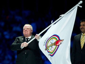 Toronto Mayor Rob Ford carries the Pan American games flag in Omnilife Stadium during the closing ceremonies of the 2011 Pan American Games in Guadalajara, Mexico on Sunday, Oct. 30, 2011. Toronto will host the games in 2015. (THE CANADIAN PRESS/Nathan Denette)