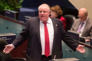 Toronto Mayor Rob Ford speaks from the council floor at city hall in Toronto on Thursday, January 30, 2014. The mayor is named in a lawsuit in which Scott MacIntyre alleges that Ford conspired in his jailhouse beating. (Chris Young /The Canadian press)
