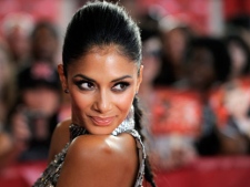 Nicole Scherzinger, a judge on "The X Factor," poses at a world premiere screening event for the new television series, Wednesday, Sept. 14, 2011, in Los Angeles. The competition series gives viewers the opportunity to choose the next breakout music star or group. (AP Photo/Chris Pizzello)