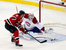 Montreal Canadiens goalie Carey Price (31), blocks a penalty shot by New Jersey Devil's Zach Parise (9) during the third period of an NHL hockey game in Newark, N.J., Saturday, Dec. 10, 2011. The Canadiens won 2-1. (AP Photo/Mel Evans)