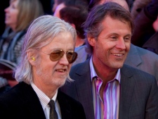 Jim Cuddy, right, and Greg Keelor of Blue Rodeo arrive on the red carpet at the 2011 JUNO Awards in Toronto on Sunday, March 27, 2011. (THE CANADIAN PRESS)