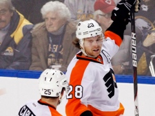 Philadelphia Flyers forward Claude Giroux celebrates his game-winning goal with teammate Erik Gustaffsson (25) during an NHL game against the Buffalo Sabres in Buffalo, N.Y., Wednesday, Dec. 7, 2011. The Flyers won 5-4. (AP Photo/Derek Gee)