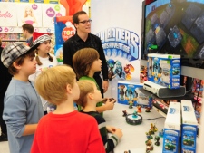 Kids play the Skylanders Spyro's Adventure video game during Toys 'R' Us' launch of its "Holiday Hot 20 Toy List." (Toys 'R' Us)