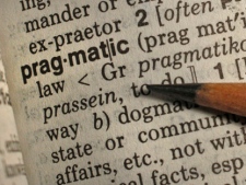 A pencil points out the word "pragmatic," Merriam-Webster's word of the year for 2011. The adjective, which means practical and locgical, was looked up so often on the company's online dictionary site that the publisher said "pragmatic" was the pragmatic choice. (AP Photo/Charles Krupa)