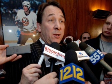 ew York Islanders' general manager Mike Milbury talks to the media after team owner Charles Wang announced that Milbury will step aside as general manager after a replacement is found, during a news conference in Uniondale, N.Y., Thursday, Jan. 12, 2006. Wang also announced that Brad Shaw will replace the recently fired Steve Stirling as the Islanders' coach. (AP Photo/Henny Ray Abrams)