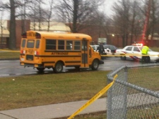 A woman was killed when she was struck by a school bus at Jane Street and Driftwood Avenue on Wednesday, Dec. 21, 2011. (CP24/Cam Woolley)