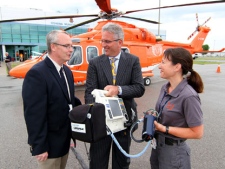 John Henry (left), Mayor of Oshawa, Tom Lepine, Chief Operating Officer, Ornge, and Tara Williams, Ornge Paramedic, in front of the new AW139 medically-equipped helicopter at the Oshawa Municipal Airport, Wednesday July 6, 2011. (The Canadian Press Images PHOTO/Ornge)