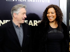 Actor Robert De Niro and wife Grace Hightower attend the premiere of "New Year's Eve" at the Ziegfeld Theatre on Wednesday, Dec. 7, 2011 in New York. (AP Photo/Evan Agostini)