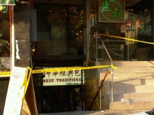 Police close off the scene of a stabbing in Chinatown on Dec. 28, 2011. (Karman Wong/CP24)