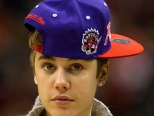 Justin Bieber walks off the court during second half NBA action between the Toronto Raptors and the Indiana Pacers in Toronto on Wednesday December 28, 2011.(THE CANADIAN PRESS/Frank Gunn)