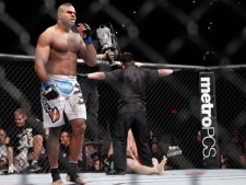 Alistair Overeem, of the Netherlands, celebrates his first round TKO victory over Brock Lesnar, right, after their UFC 141 heavyweight mixed martial arts match, Friday, Dec. 30, 2011, at The MGM Grand Garden Arena in Las Vegas. Lesnar retired following the fight. (AP Photo/Eric Jamison)