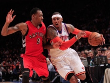 New York Knicks' Carmelo Anthony (7) drives past Toronto Raptors' Rasual Butler (9) during the first half of an NBA basketball game Monday, Jan. 2, 2012, in New York. (AP Photo/Frank Franklin II)