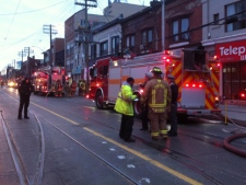 A Toronto firefighter was injured while battling a blaze on College Street on Wednesday, Jan. 4, 2012. (CP24/Tom Stefanac) 