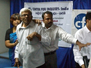 Organizers try to protect Bangladeshi writer Taslima Nasrin, far left, as he is attacked by Muslim protesters, unseen during her book release in Hyderabad, India on Thursday, Aug 9, 2007. Nasrin escaped unhurt as the organizers pushed back nearly 100 protesters, led by three lawmakers. In the melee, one of the protesters slapped her and told her to go back to her country, according to eyewitnesses. (AP Photo/Mahesh Kumar A)