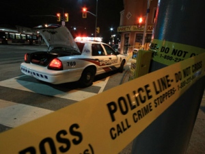 A Toronto police car and police tape are pictured on St. Clair Avenue West, near Old Weston Road, after a man was shot and wounded early Thursday, Jan. 5, 2012. (CP24/Tom Stefanac)