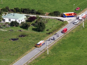 This aerial photo shows the area where a hot air balloon crashed after it caught on fire in Carterton, north of the capital, Wellington, New Zealand, Saturday, Jan. 7, 2012. The hot air balloon crashed and killed all 11 people aboard near the rural New Zealand town some 94 miles (150 kilometers) north of the capital, Wellington, officials said Saturday. (AP Photo/Wairarapa Times, Lynda Feringa)
