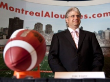 Montreal Alouettes general manager Jim Popp arrives at a news conference announcing he has signed an extension to his contract with the Alouettes through the 2014 season Wednesday August 4, 2010 in Montreal. THE CANADIAN PRESS/Paul Chiasson