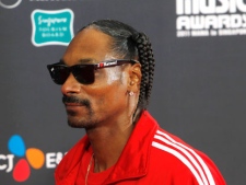 American rapper Snoop Dogg arrives on the red carpet at the 2011 Mnet Asian Music Awards in Singapore on Tuesday, Nov. 29, 2011. (AP Photo/Terence Tan)