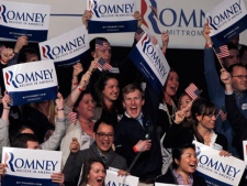 Supporters at the for Romney for President New Hampshire primary night rally at Southern New Hampshire University in Manchester, N.H., Tuesday, Jan. 10, 2012 cheer as it is announced that the election has been called for former Massachusetts Gov. Mitt Romney. (AP Photo/Elise Amendola)